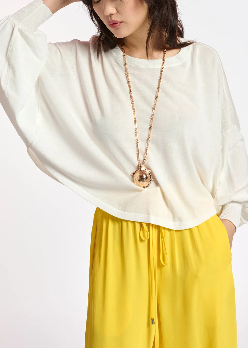 Off-white cotton-blend sweater with cape effect